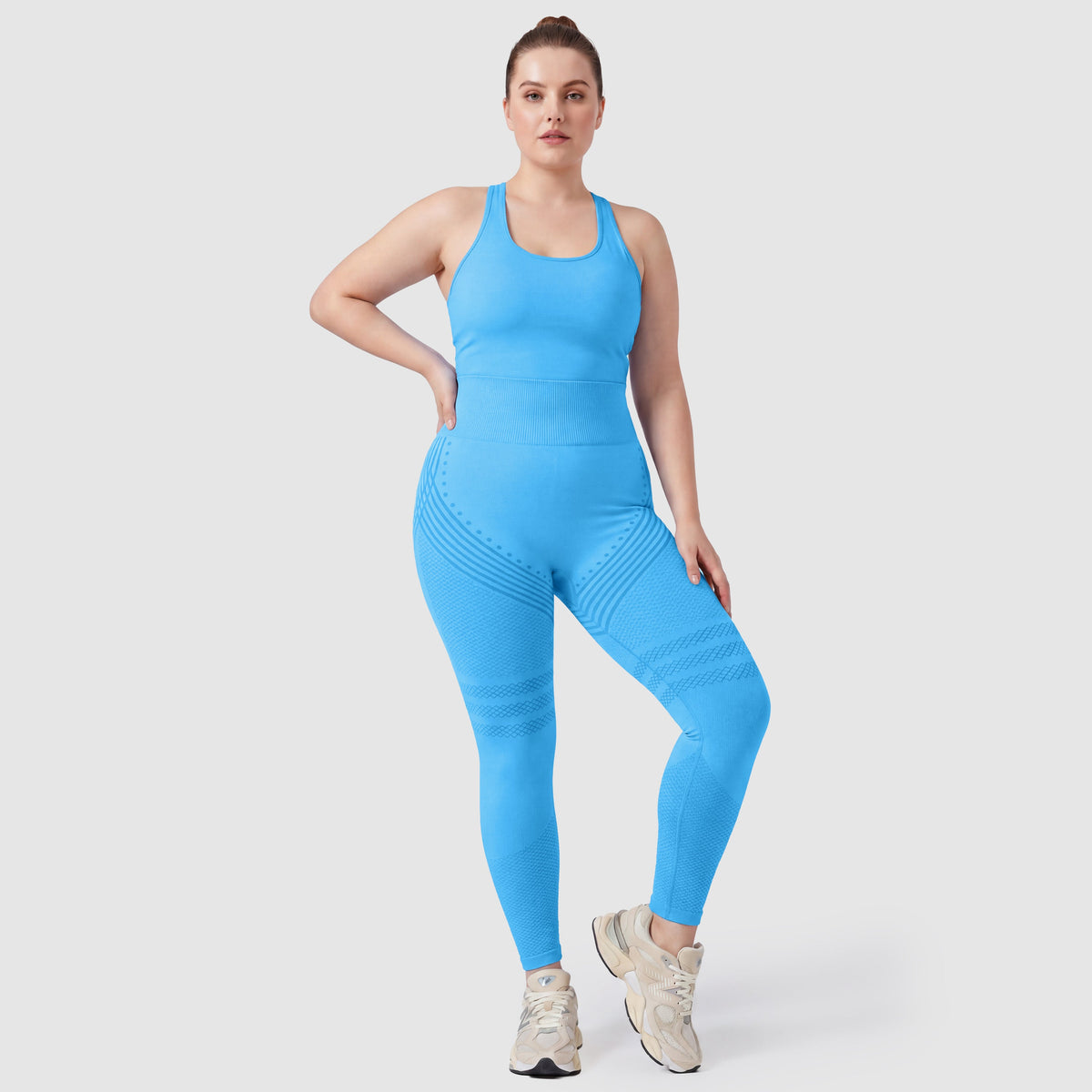 Kvinna i Sculpt 3D™ anticellulitleggings i turkos, framifrån, hög midja